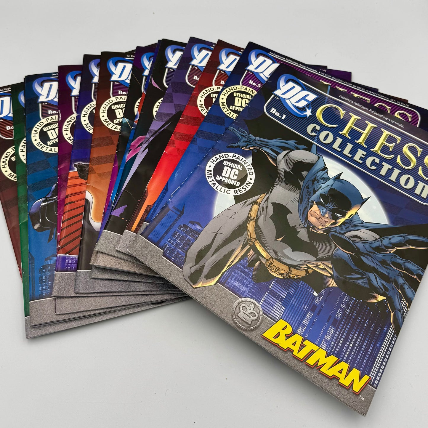 Highly collectible Eaglemoss DC Batman chess pieces with comic magazines
