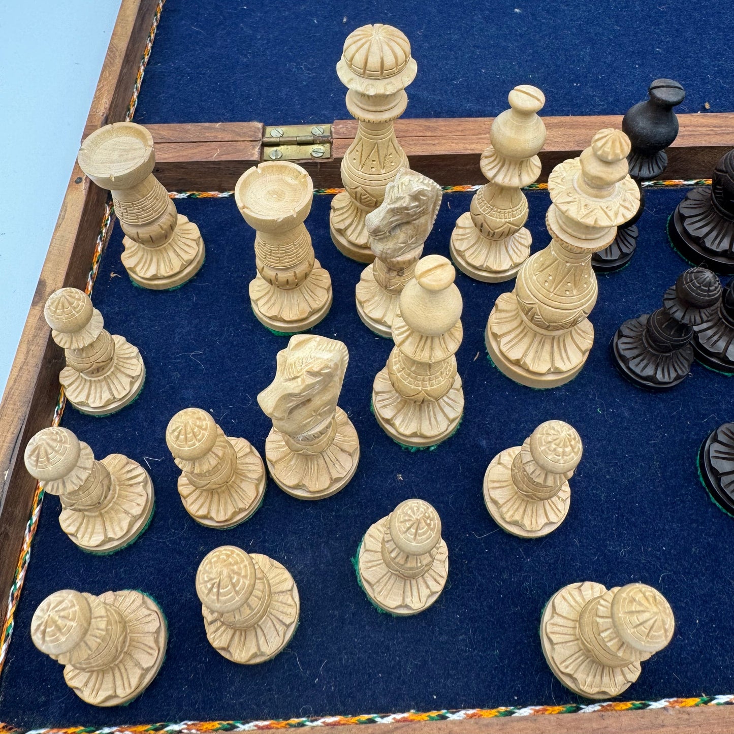Vintage wooden lotus design chess pieces in wooden folding chess board