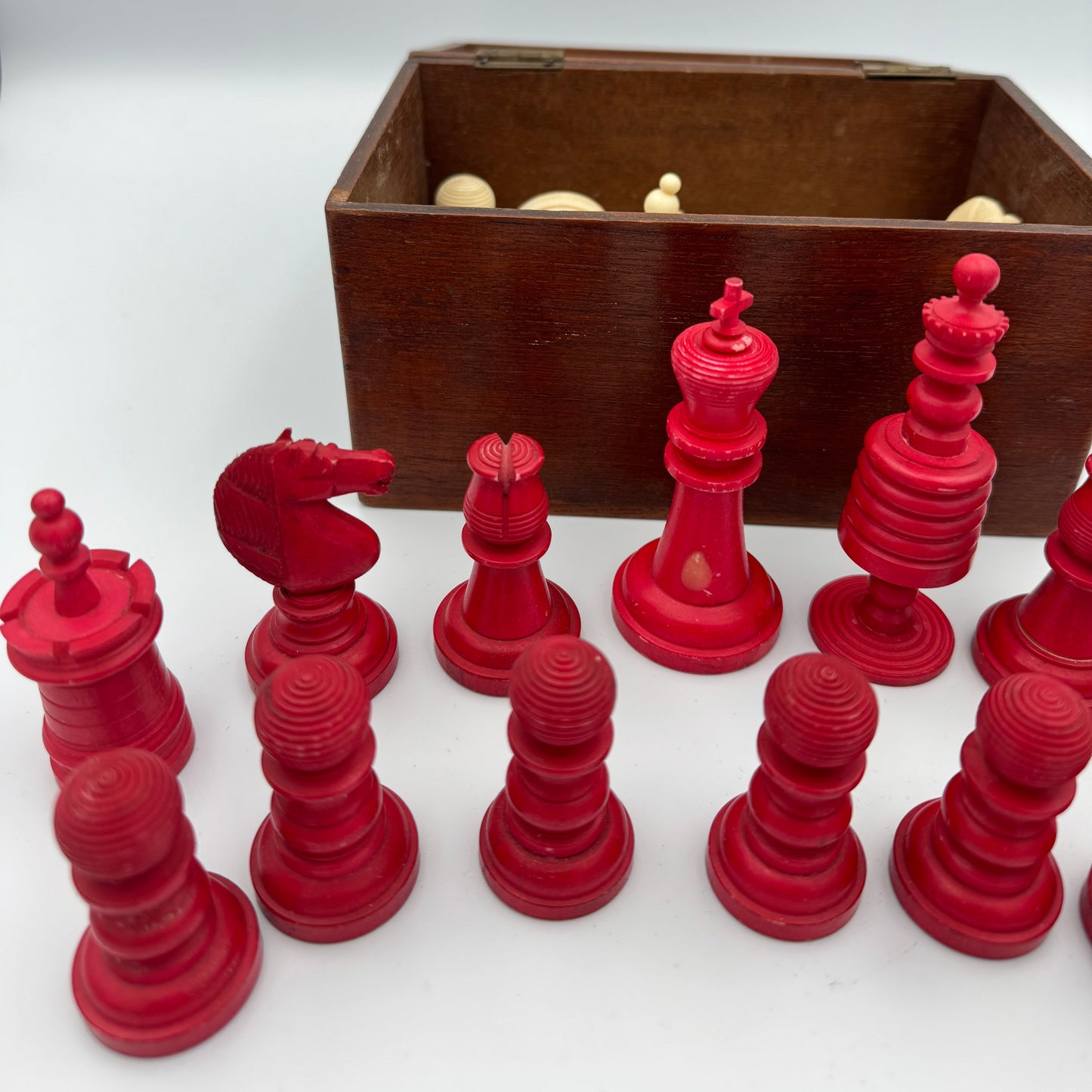 19th century red and cream bone barleycorn chess pieces