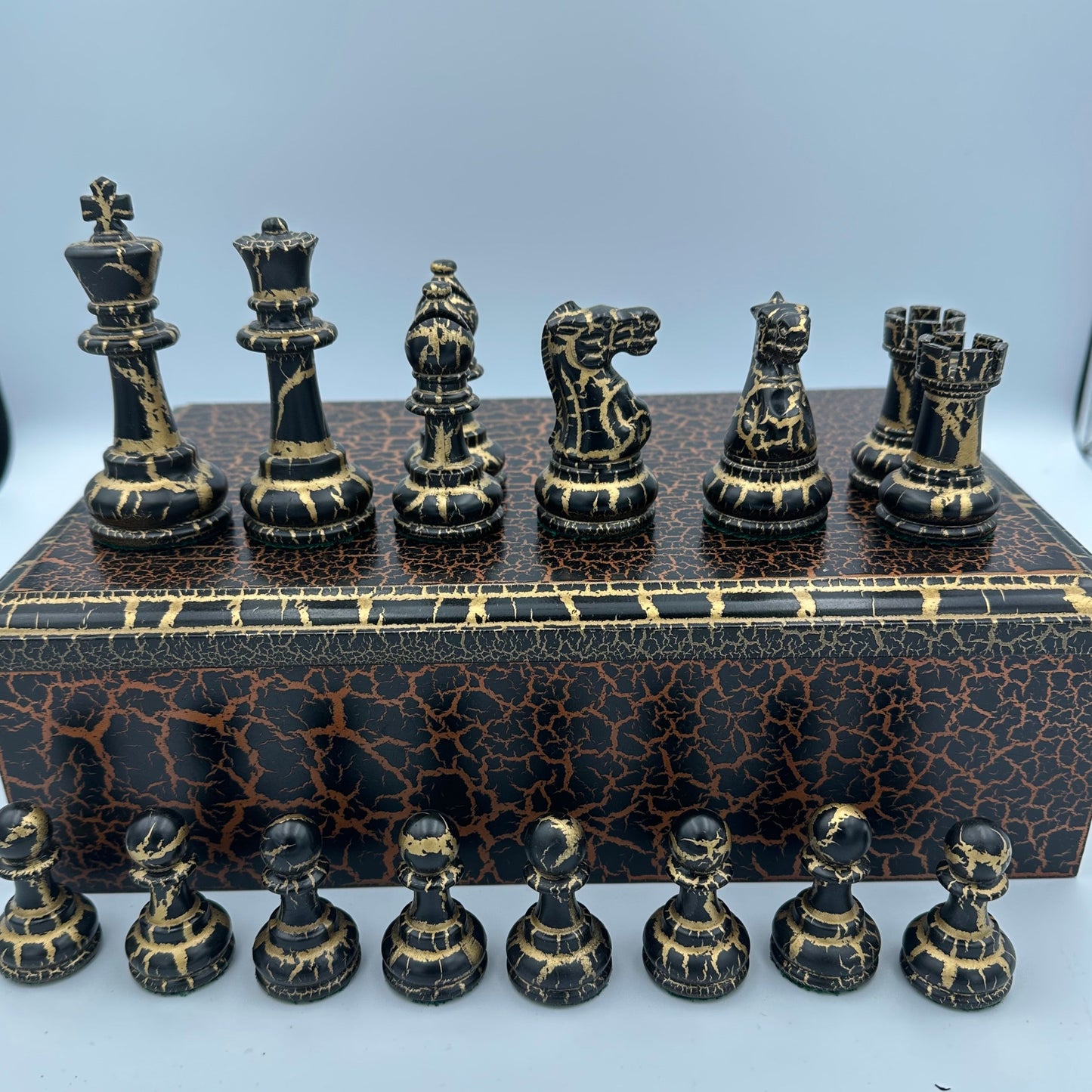 Staunton style chess pieces with bronze and gold crackle paint effect and matching box