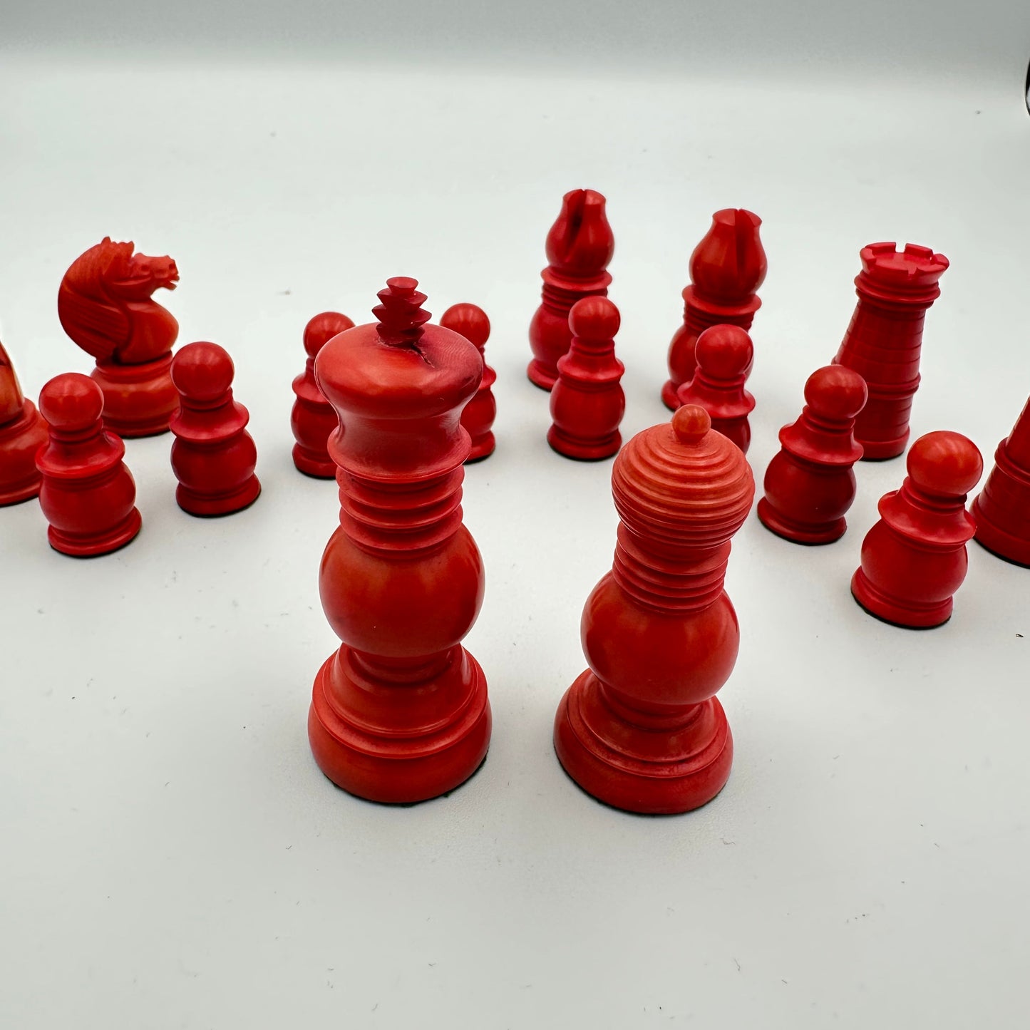 Antique Tagua nut red and cream chess pieces