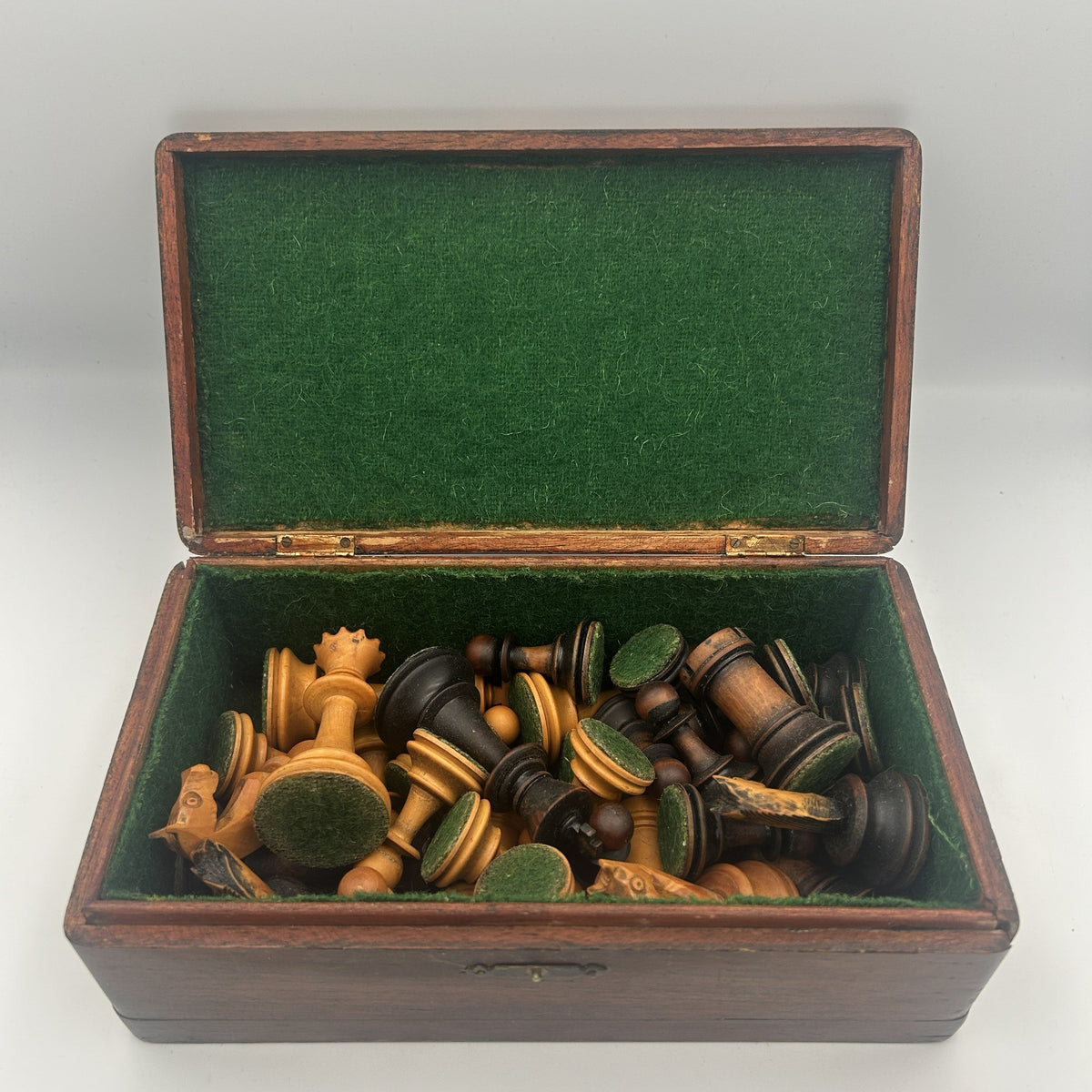 Antique dogfaced knight Staunton style chess pieces in wooden box