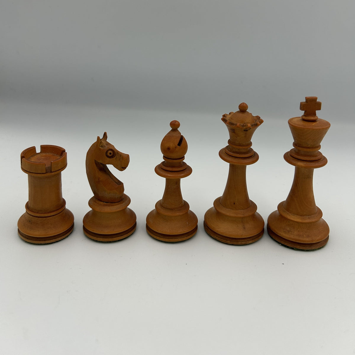 Antique dogfaced knight Staunton style chess pieces in wooden box