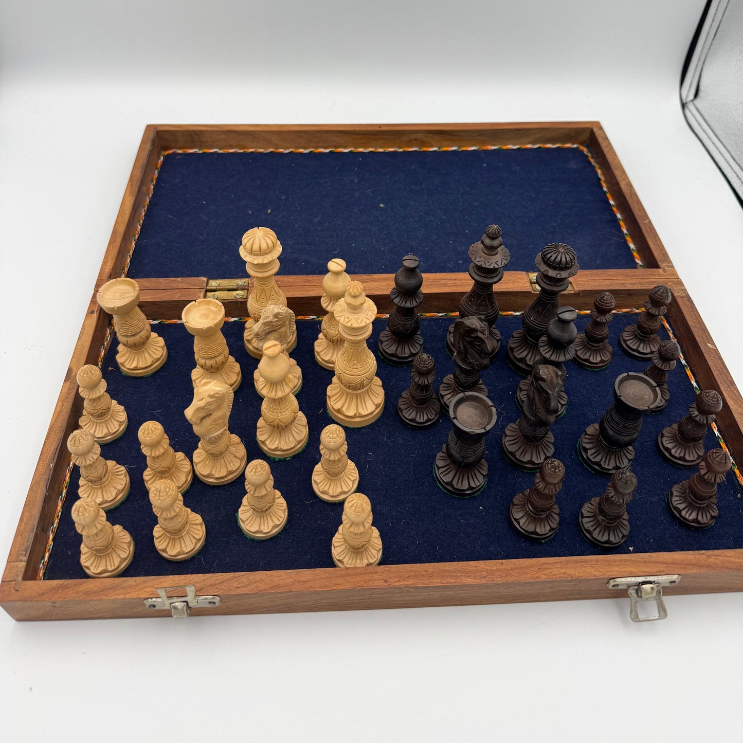 Vintage wooden lotus design chess pieces in wooden folding chess board