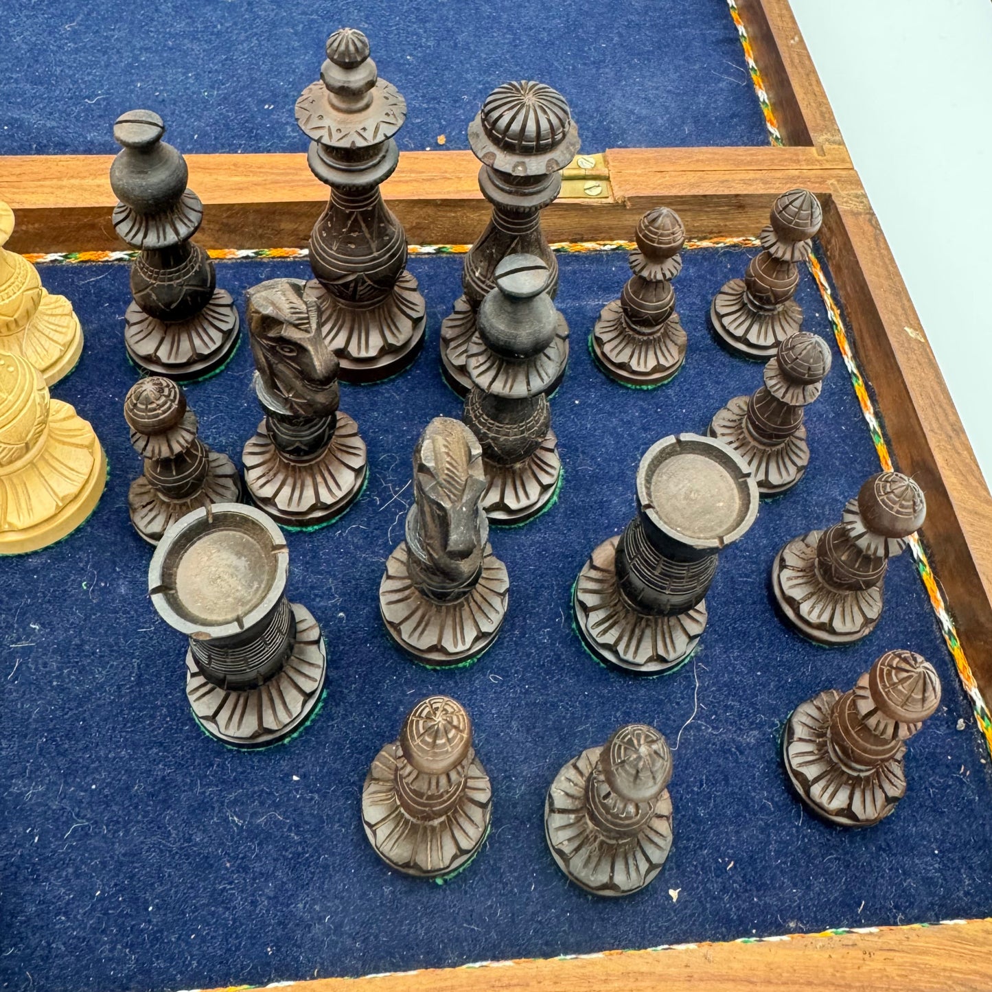 Vintage wooden lotus design chess pieces in wooden folding chess board