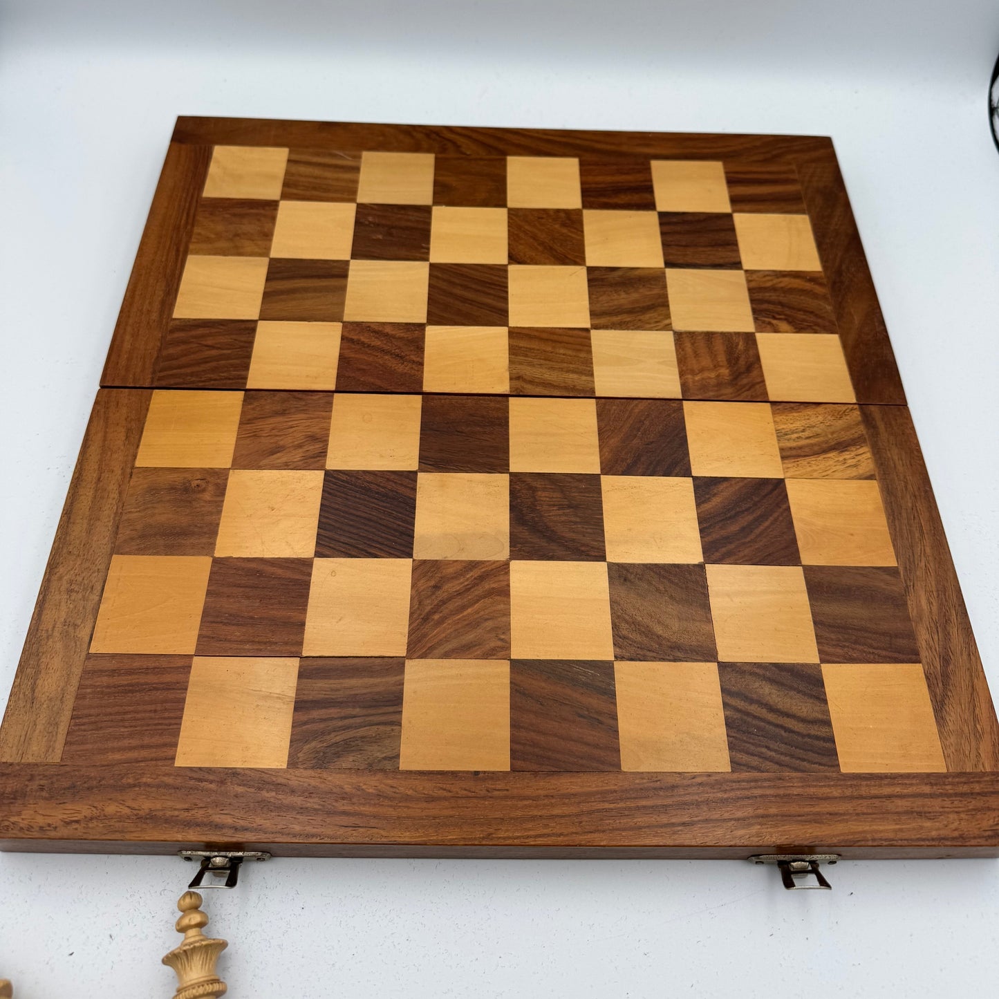 Vintage wooden lotus design chess pieces in wooden folding chess board