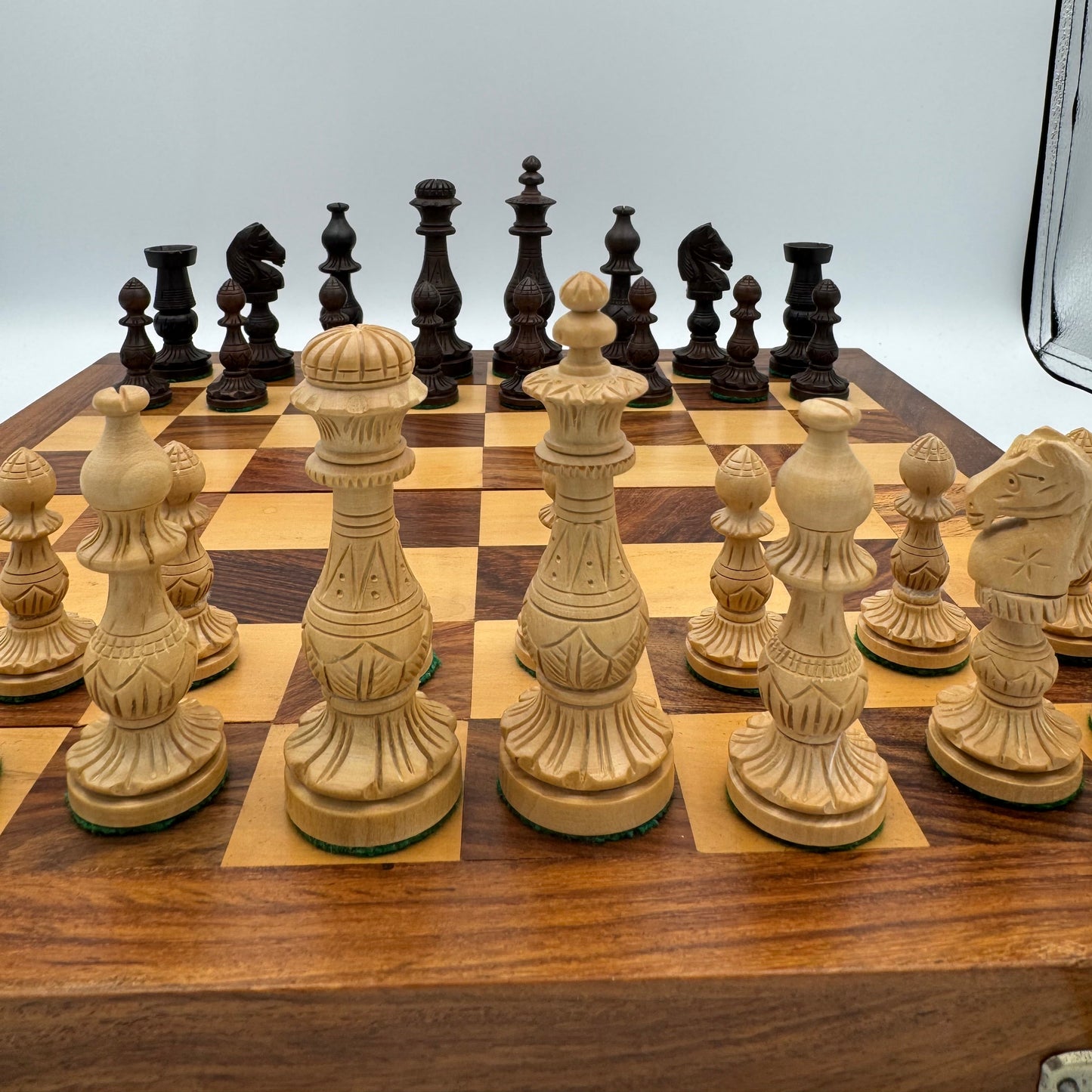 Vintage wooden lotus design chess pieces in wooden folding chess board
