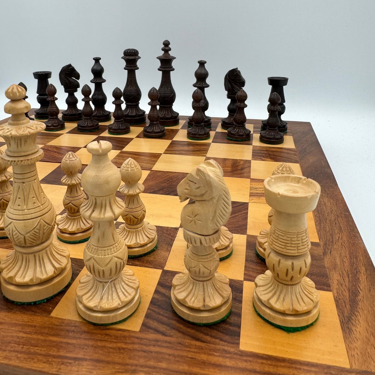 Vintage wooden lotus design chess pieces in wooden folding chess board