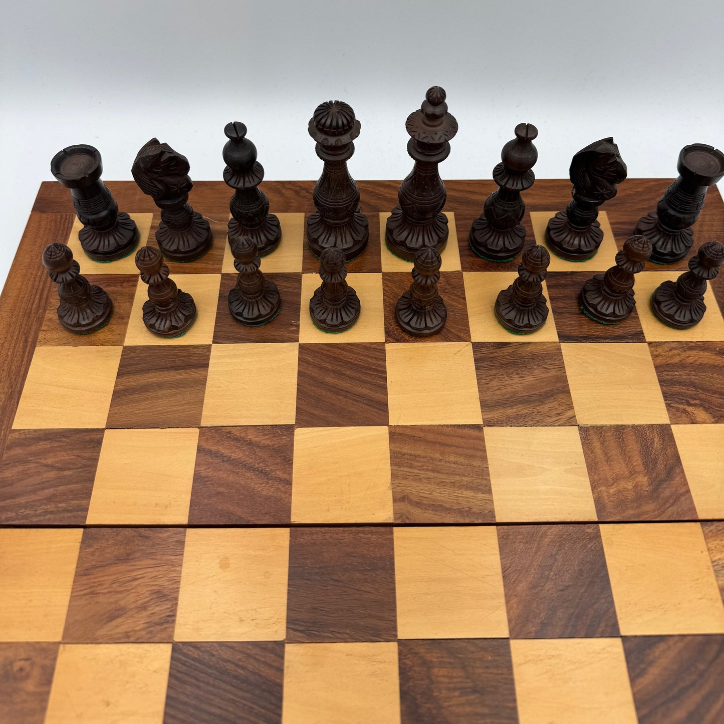 Vintage wooden lotus design chess pieces in wooden folding chess board
