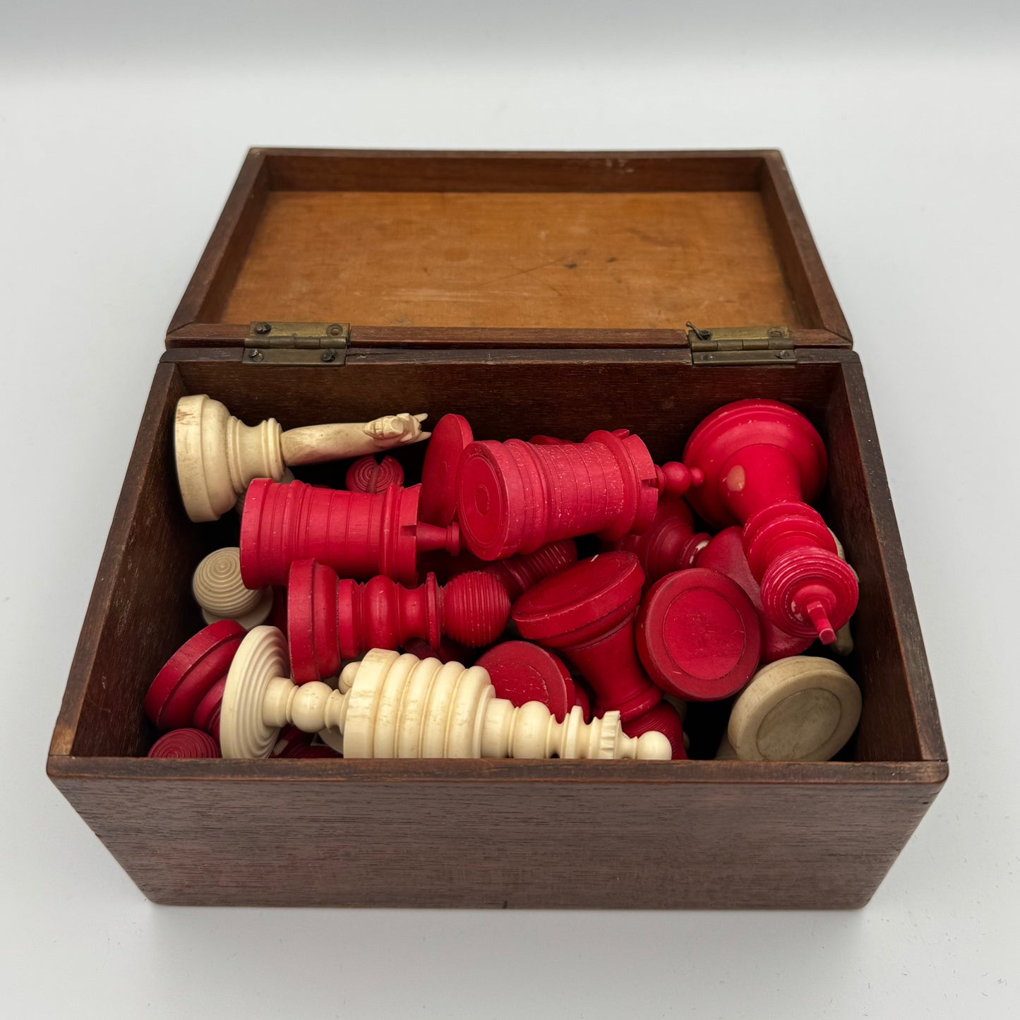 19th century red and cream bone barleycorn chess pieces