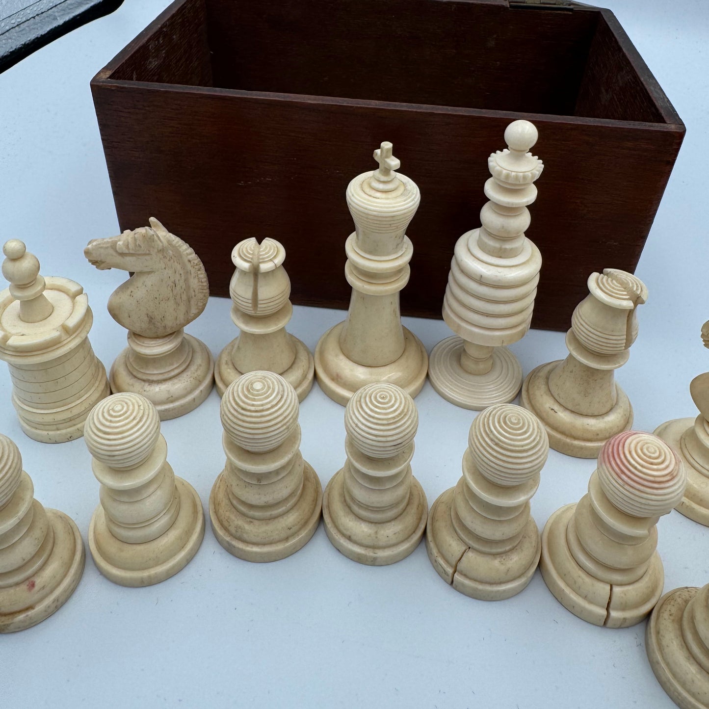 19th century red and cream bone barleycorn chess pieces