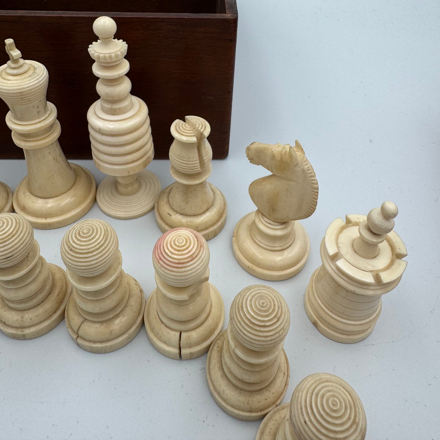 19th century red and cream bone barleycorn chess pieces