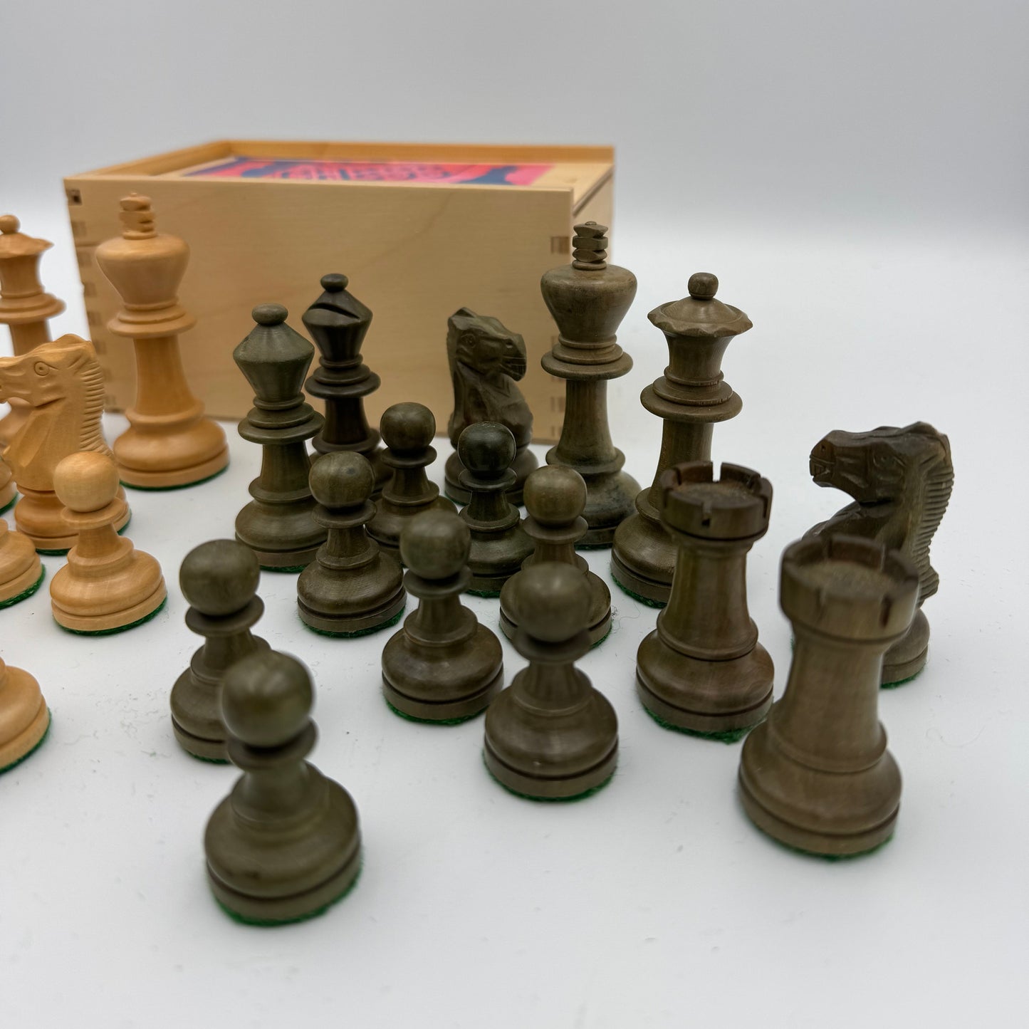 Unusual olive green and natural wooden Staunton style pieces in Jaques box