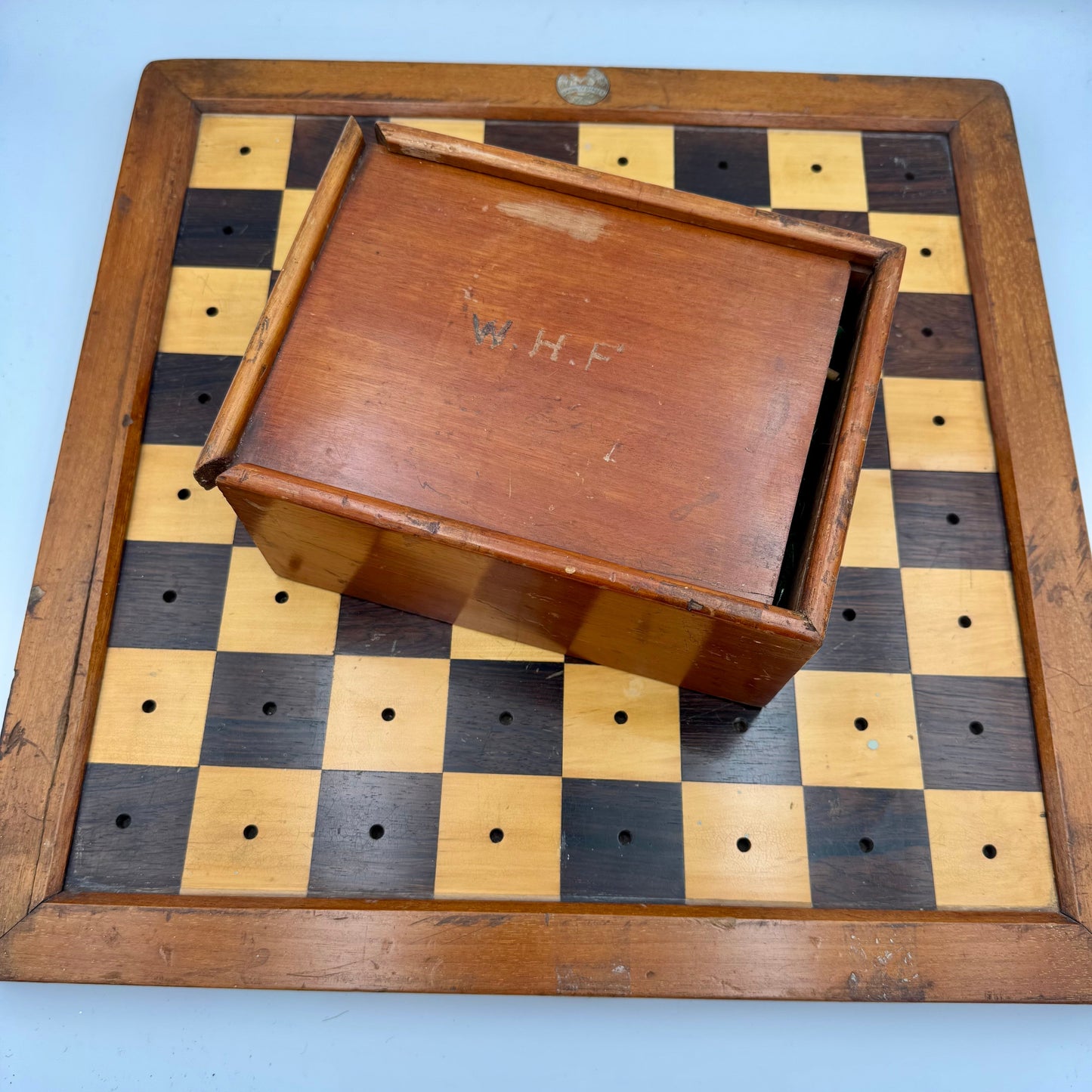 Very rare 1890's Henry Whitty & Son, Jaques & Son of London ship's chess board and pegged pieces.