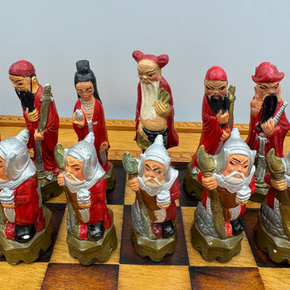 Vintage hand painted ceramic Chinese chess pieces depicting warriors and royalty.