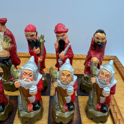 Vintage hand painted ceramic Chinese chess pieces depicting warriors and royalty.
