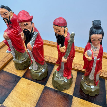 Vintage hand painted ceramic Chinese chess pieces depicting warriors and royalty.