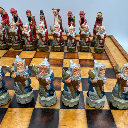 Vintage hand painted ceramic Chinese chess pieces depicting warriors and royalty.