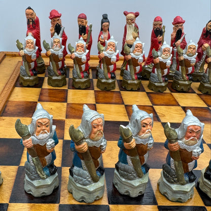 Vintage hand painted ceramic Chinese chess pieces depicting warriors and royalty.