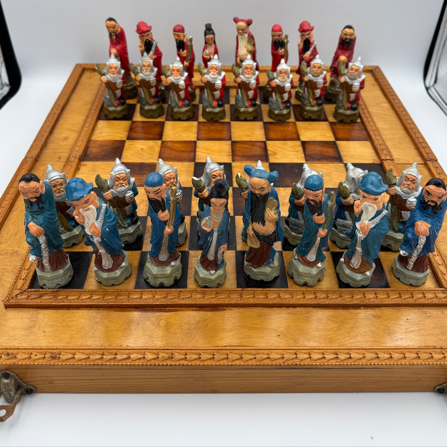 Vintage hand painted ceramic Chinese chess pieces depicting warriors and royalty.