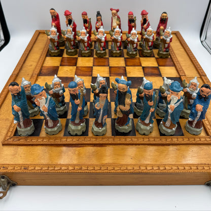 Vintage hand painted ceramic Chinese chess pieces depicting warriors and royalty.