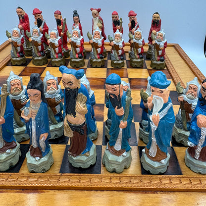 Vintage hand painted ceramic Chinese chess pieces depicting warriors and royalty.