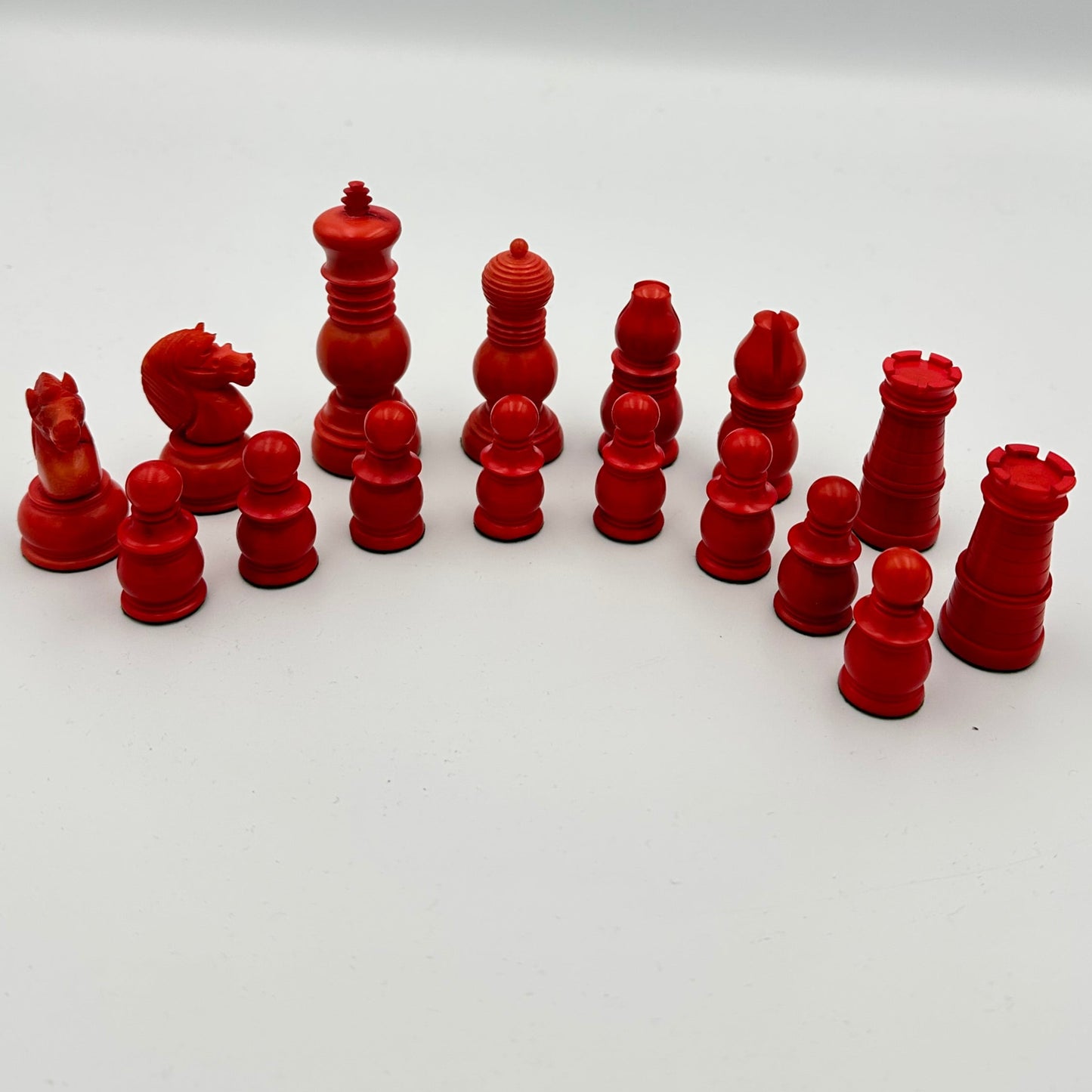 Antique Tagua nut red and cream chess pieces