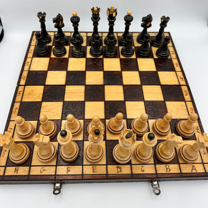 Vintage folding wooden pyrography chess board with hand carved Staunton style pieces