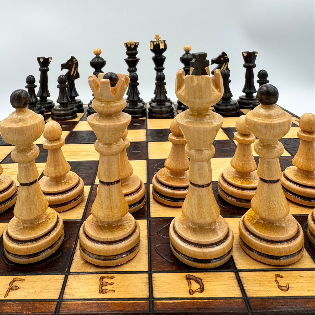 Vintage folding wooden pyrography chess board with hand carved Staunton style pieces