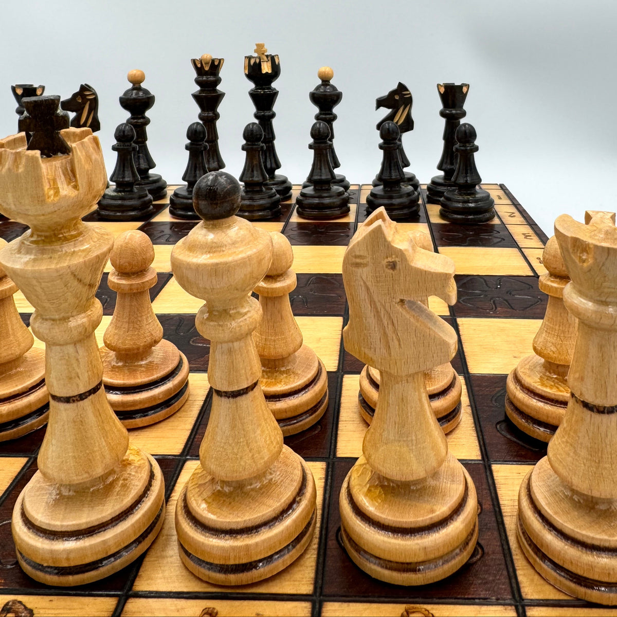 Vintage folding wooden pyrography chess board with hand carved Staunton style pieces