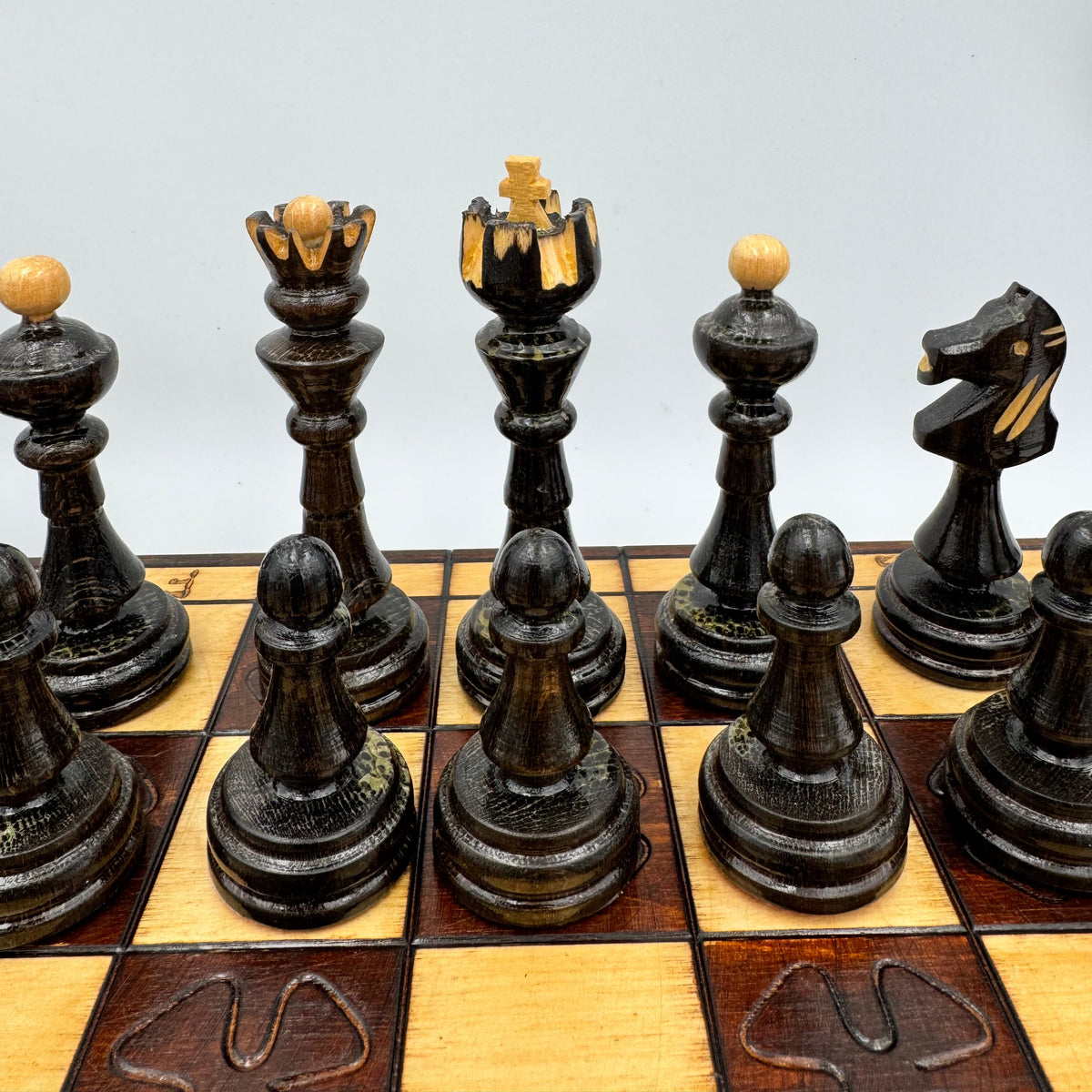 Vintage folding wooden pyrography chess board with hand carved Staunton style pieces