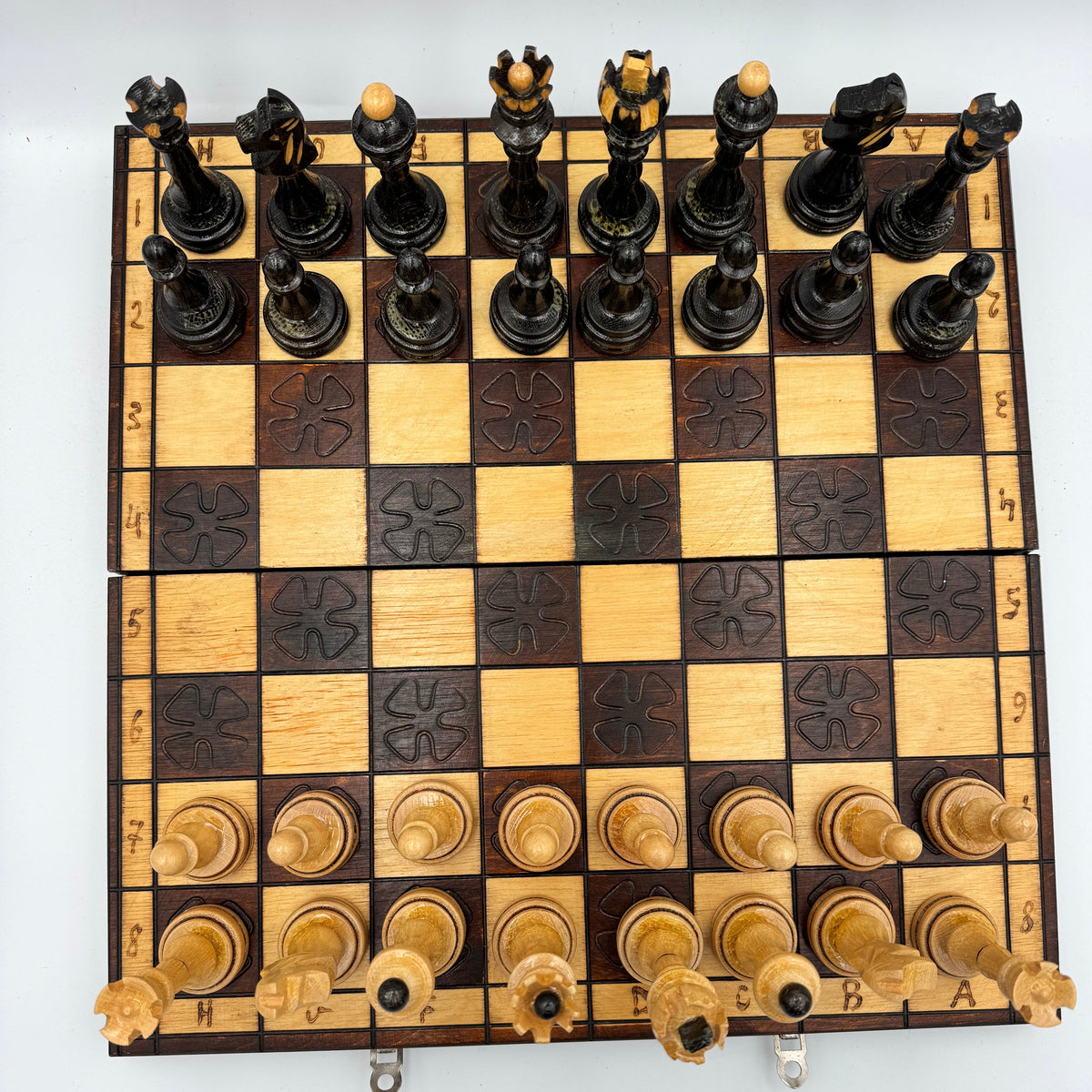 Vintage folding wooden pyrography chess board with hand carved Staunton style pieces