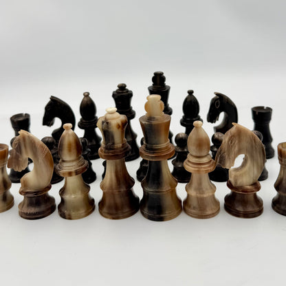 1960's library sized cow horn chess set