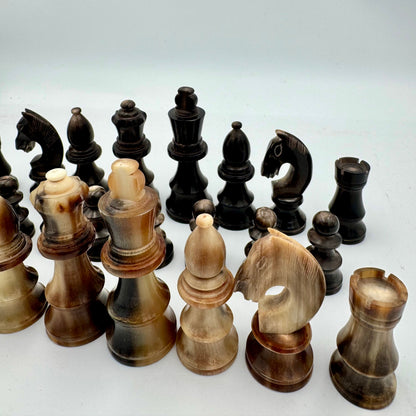 1960's library sized cow horn chess set