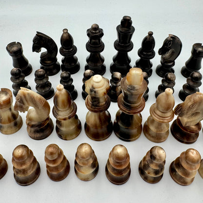 1960's library sized cow horn chess set