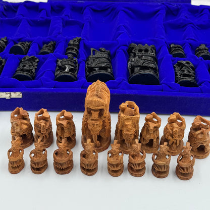 Intricately hand carved Indian sandalwood and ebonised figural "Howdah" chess set circa 1950s-1970s
