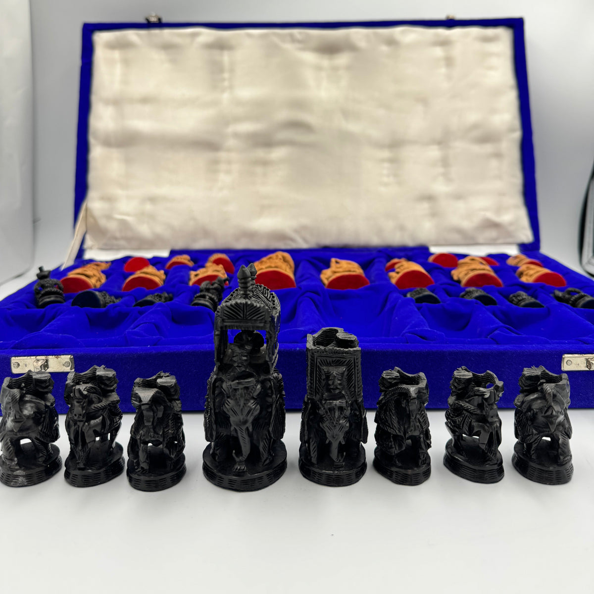 Intricately hand carved Indian sandalwood and ebonised figural "Howdah" chess set circa 1950s-1970s